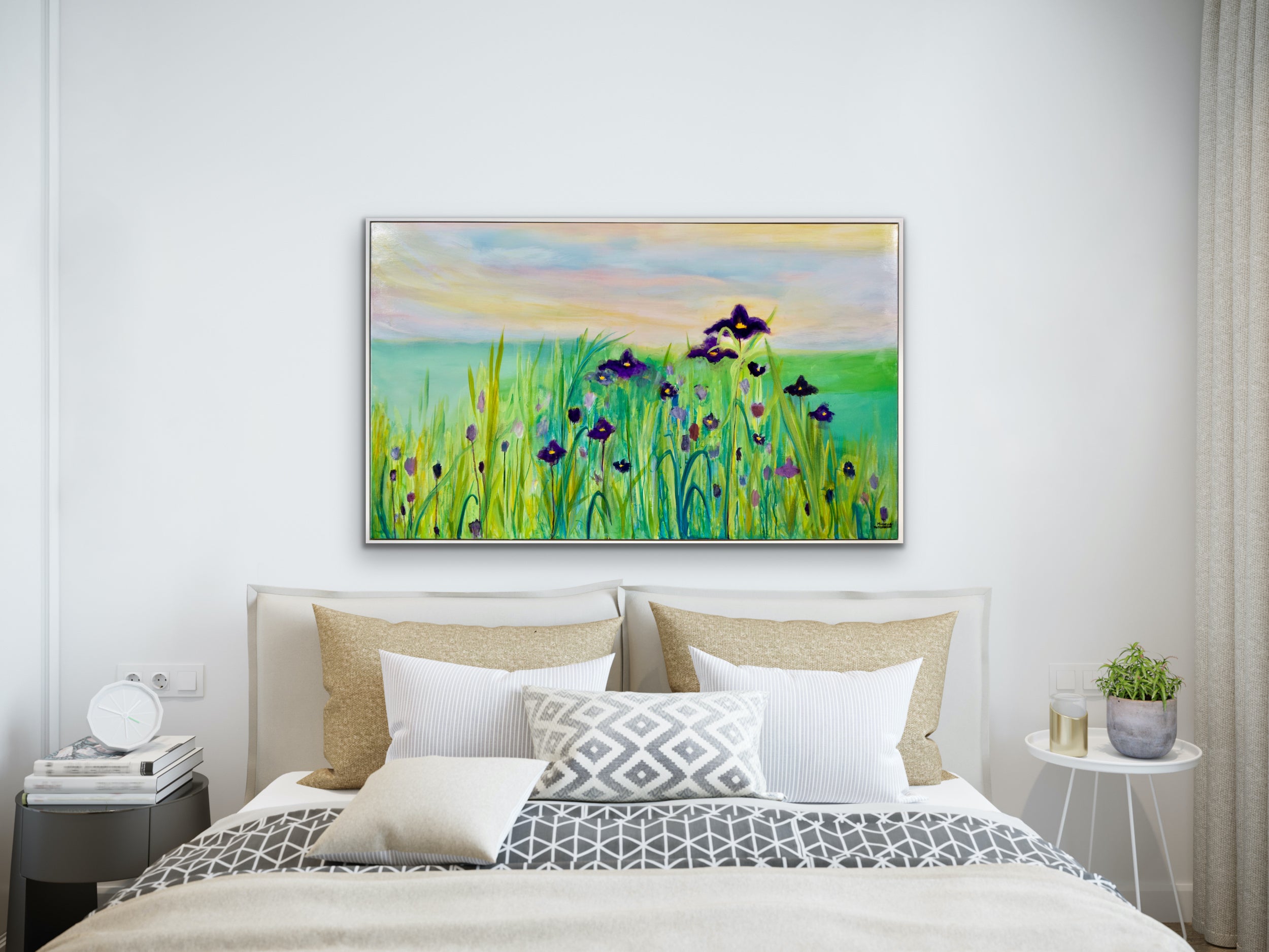 Purple irises with teal water and pretty sky displayed above a bed with neutral furnishings
