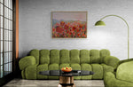 Load image into Gallery viewer, Landscape of colourful tulips in  room setting with green sofa and white brick walls
