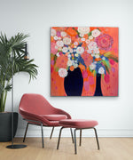 Load image into Gallery viewer, Shown in a room setting of white wall and rose coloured chair and ottoman
