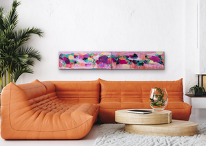 Two paintings (shown as a Diptych) above an orange sofa.