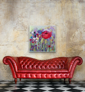 Beautiful large red poppy shown on a beige and gold wall above a red sofa. Gorgeous!