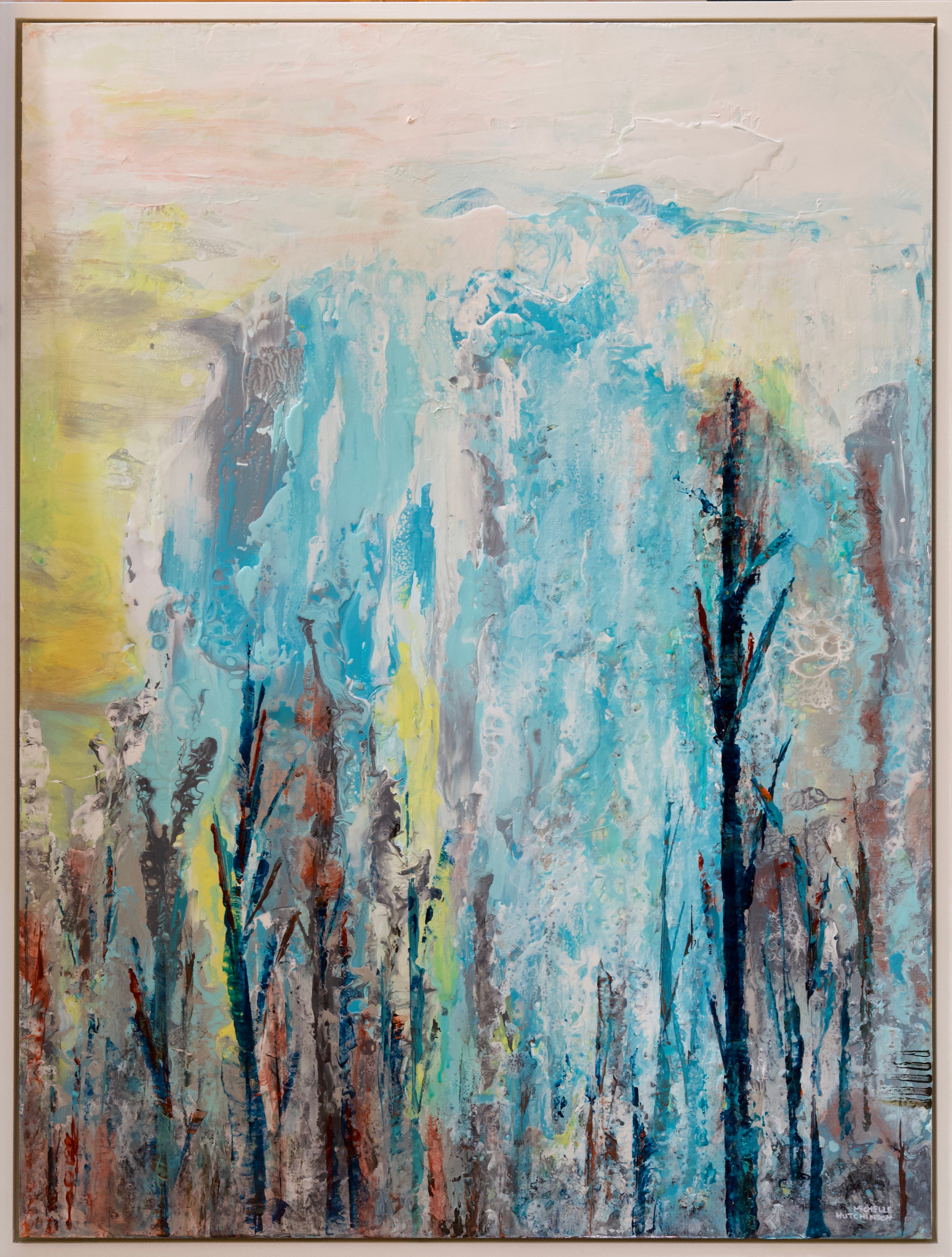 Bold abstract landscape depicts trees in the foreground with rocks and waterfall in the background. Painted in soft teals, yellows, and greys. Uses fluid acrylic pouring technique on wood panel. Includes custom white frame, bumper pads, and pre-mounted wires. Free shipping in N.A. No tax!