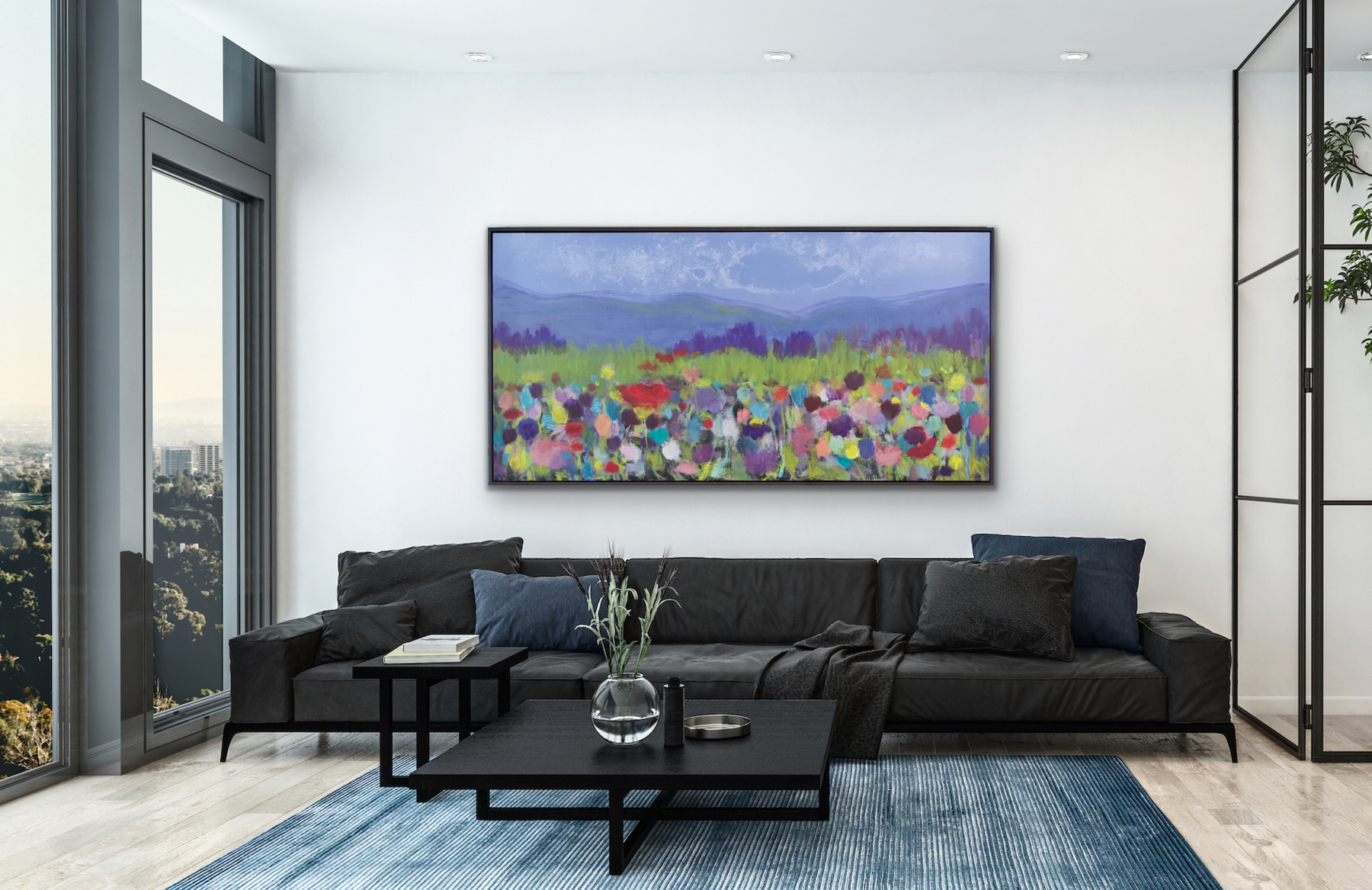 This large landscape statement piece will encourage thought and conversation is displayed in a living room setting above a large black sofa.